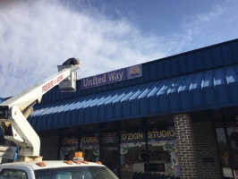 Old sign coming down.